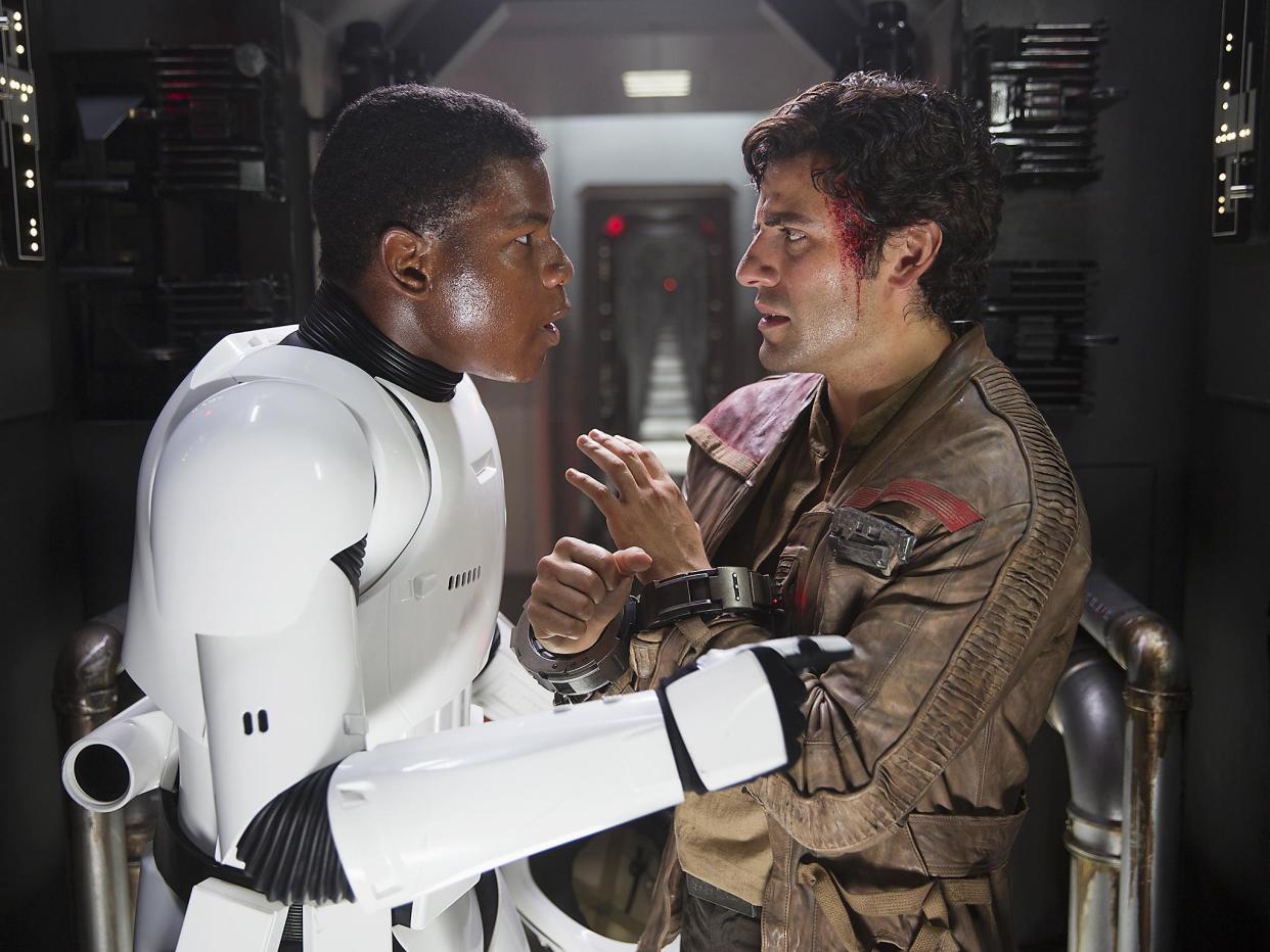 John Boyega as Finn (left) and Oscar Isaac as X-wing pilot Poe Dameron in 'Star Wars: The Force Awakens'