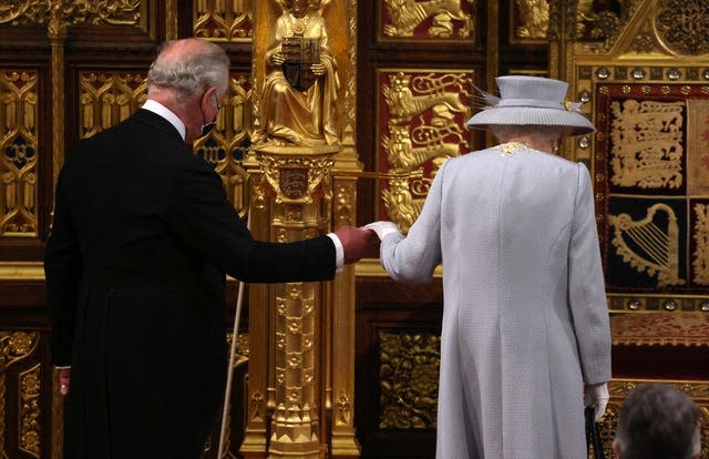 The Queen arrives with the Prince of Wales to deliver the speech