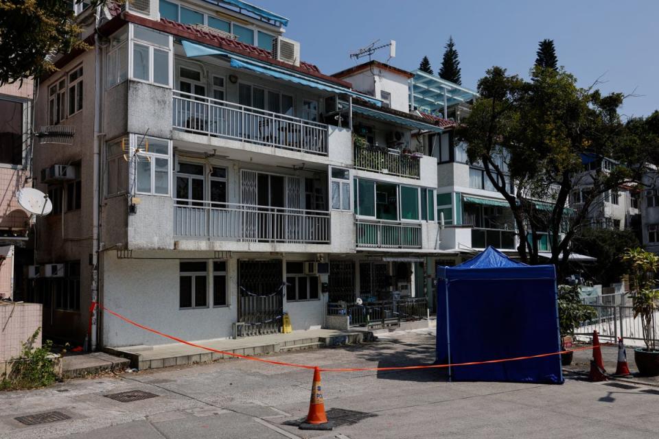 Cordons lines are seen outside a village house where part of Abby Choi's body was found in Hong Kong (REUTERS)