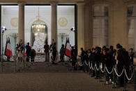 People line up to sign the condolences book to pay tribute to former President Jacques Chirac at the Elysee Palace, Thursday, Sept. 26, 2019. Jacques Chirac, a two-term French president who was the first leader to acknowledge France's role in the Holocaust and defiantly opposed the U.S. invasion of Iraq in 2003, has died Thursday at age 86. (AP Photo/Michel Euler)