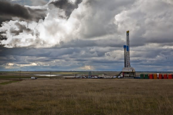 A drilling rig in North Dakota under a cloudy sky.