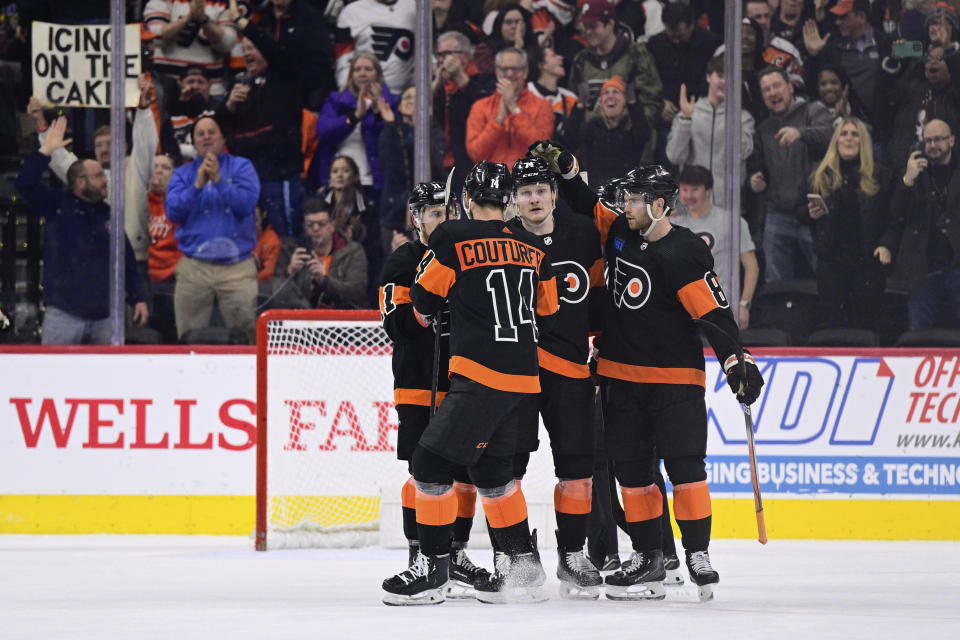 Philadelphia Flyers' Owen Tippett, second from right, celebrates after his goal during the third period of an NHL hockey game against the Arizona Coyotes, Monday, Feb. 12, 2024, in Philadelphia. (AP Photo/Derik Hamilton)