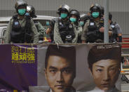 Riot police stand guard at Central during the second day of debate on a contentious bill that would criminalize insulting or abusing the Chinese national anthem, in Hong Kong, Thursday, May 28, 2020. (AP Photo/Vincent Yu)