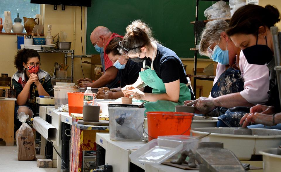 Instructor Hailey Angione watches over her "Introduction to Wheel Throwing" pottery class at the Worcester Center for Crafts on Sagamore Road last week.