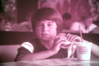 A young boy enjoys a whopper in the 1970s.