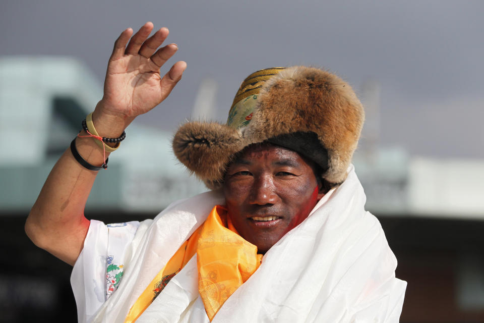 FILE - Nepalese veteran Sherpa guide Kami Rita waves as he arrives in Kathmandu, Nepal, May 20, 2018. Rita scaled Mount Everest Tuesday, May 23, 2023, for the 28th time beating his own record within a week as two guides compete with each other for the title of most climbs of the world's highest peak. (AP Photo/Niranjan Shrestha, File)