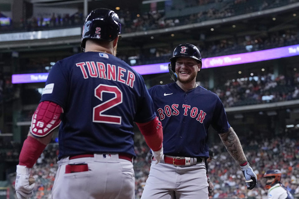 Boston Red Sox's Alex Verdugo celebrates with Justin Turner (2) after hitting a solo home run during the first inning of a baseball game against the Houston Astros, Thursday, Aug. 24, 2023, in Houston. (AP Photo/Kevin M. Cox)