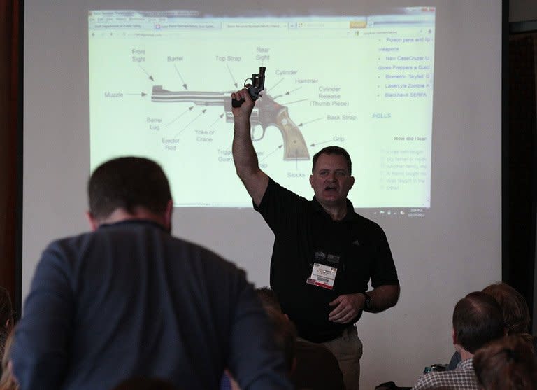 A firearms instructor teaches a concealed-weapons training class to 200 Utah teachers on December 27, 2012 in West Valley City, Utah. Several US states are considering allowing school teachers to carry weapons, and educators, determined not to allow a repeat of the Newtown massacre, are flocking to training sessions