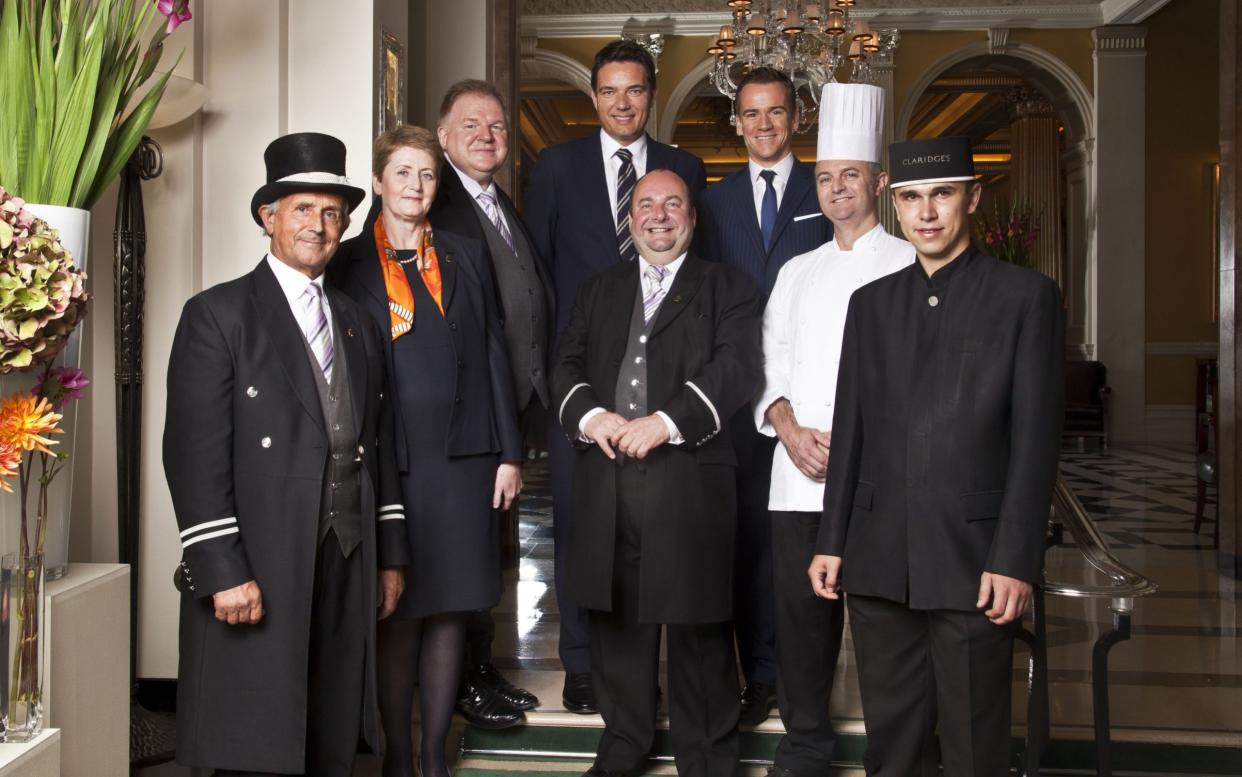 Inside Claridge's:  Staff in the hotel lobby (L to R) Roman Probodziak (Doorman), Anne Barnes (Deputy head of housekeeping), Michael Lynch (Butler), Thomas Kochs (General Manager), Martin Ballard (Concierge), Michael Bonsor (Hotel Manager), Martyn Nail (Head Chef), Page Boy - BBC