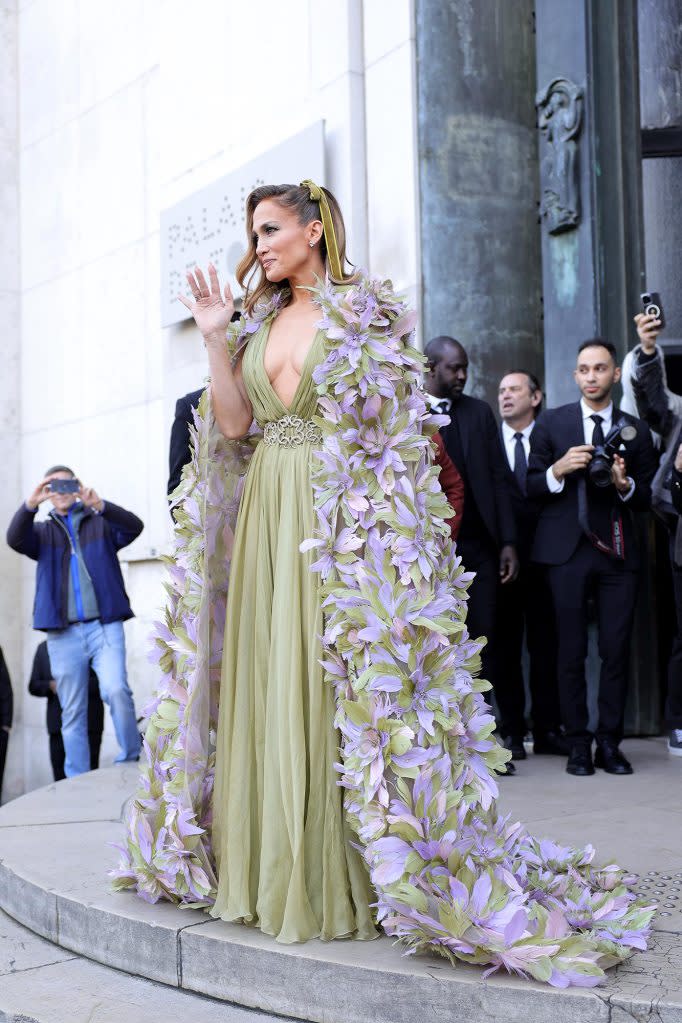 Jennifer Lopez Dons Cascading Floral Cape at Paris Fashion Week