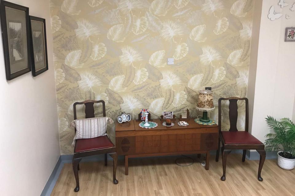 Royal Preston Hospital's 1940s style reminiscence room, featuring pictures of ration books and old photographs (PA)