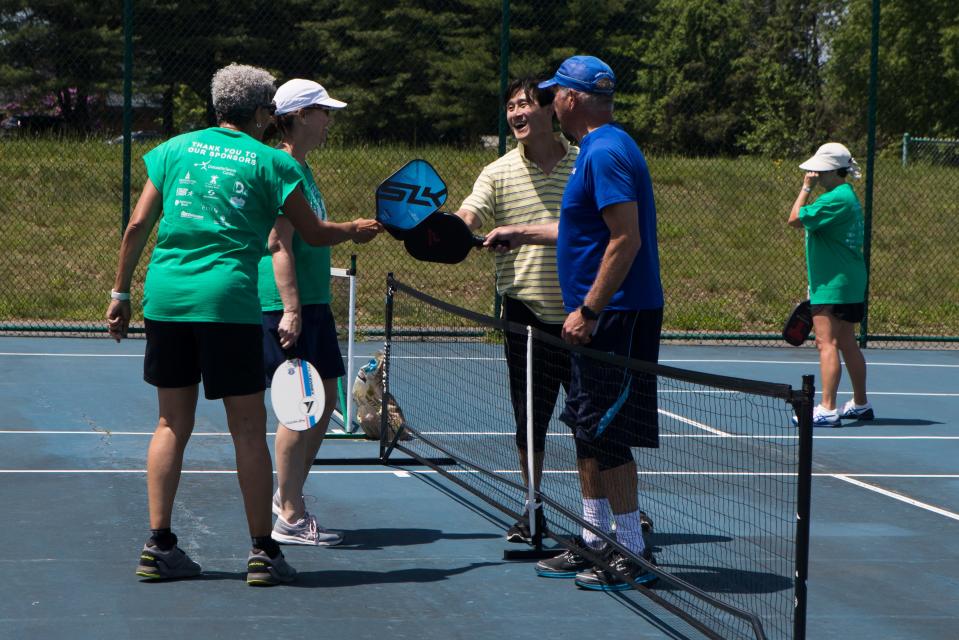 People play pickle ball at Deacons Walk Park Tuesday, May 17, 2022. 