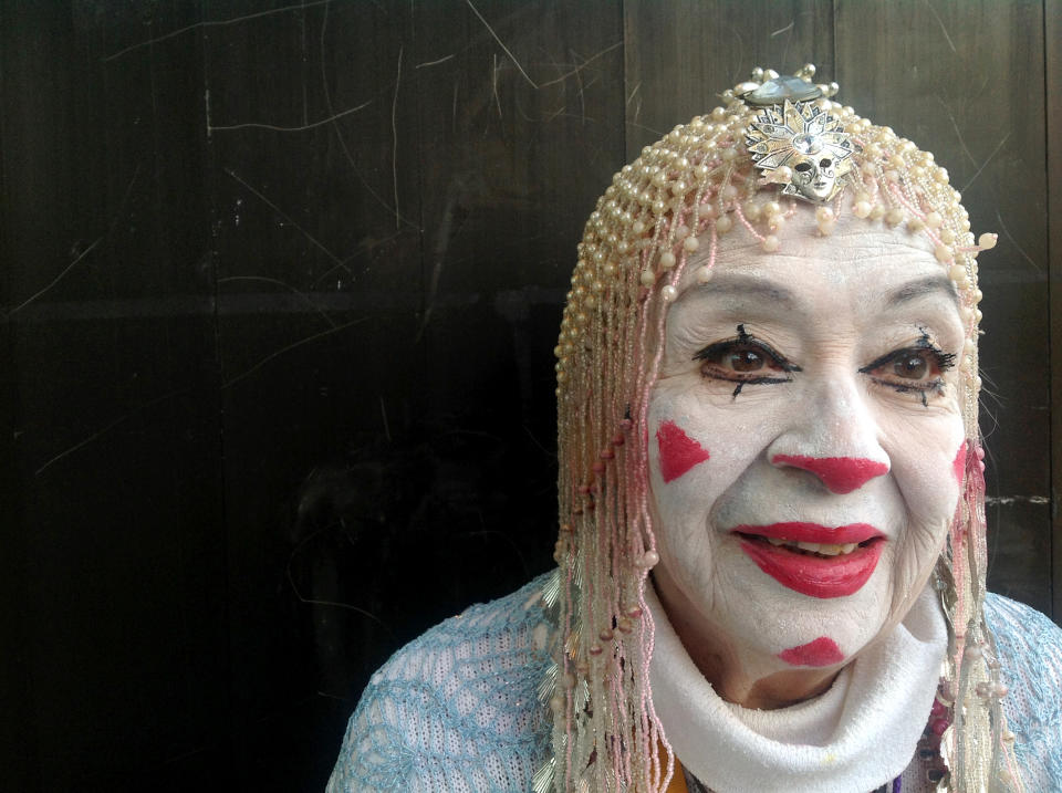 In this Tuesday, Oct. 23, 2012 photo, straight whiteface clown Tikitiki, 83, poses for a photo during Mexico's 17th annual clown convention, La Feria de la Risa, in Mexico City. Approximately 500 clowns gathered at two local theaters in the capital city to exchange ideas, compete for laughs and show off their comedy performances. (AP Photo/Anita Baca)