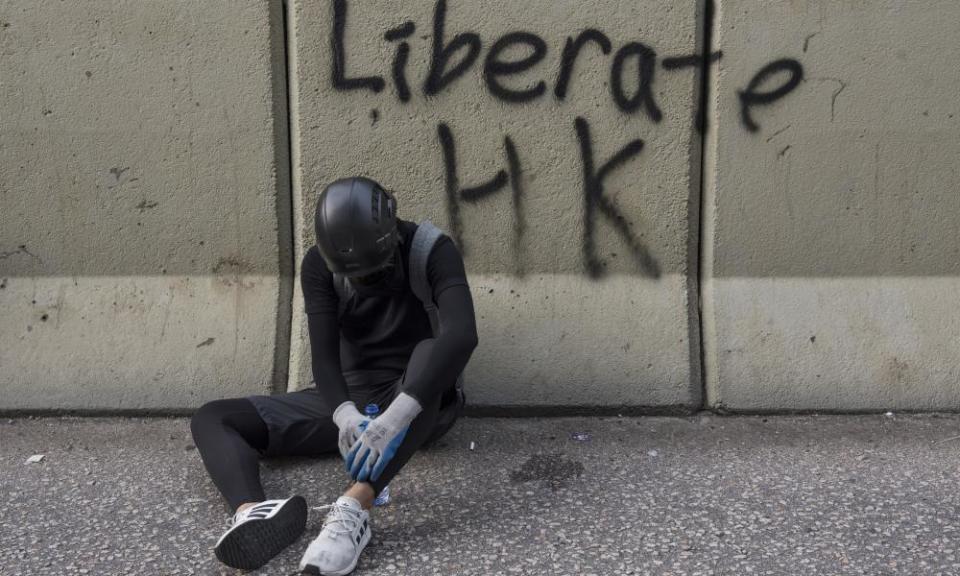 A protester rests on the street on Saturday.