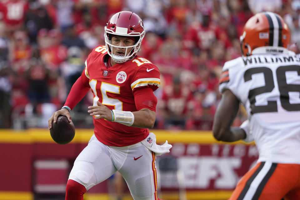 Kansas City Chiefs quarterback Patrick Mahomes (15) scrambles as Cleveland Browns cornerback Greedy Williams (26) defends during the second half of an NFL football game Sunday, Sept. 12, 2021, in Kansas City, Mo. (AP Photo/Ed Zurga)