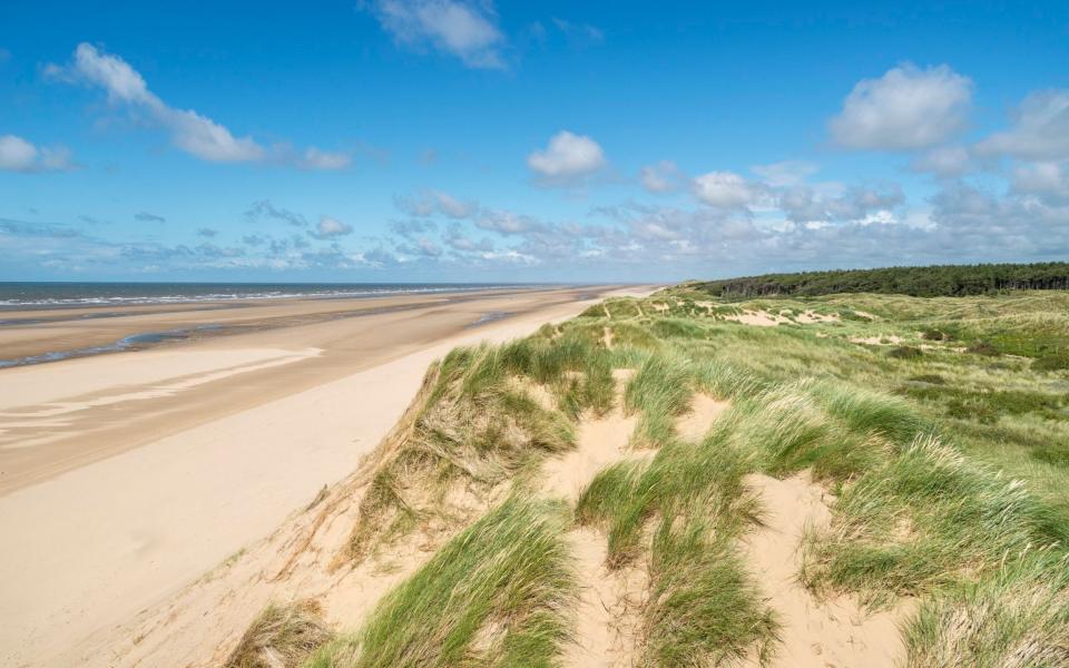 Formby is where locals go to clear the head, take a paddle, or picnic in the dunes - getty