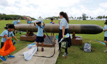 <p>Pupils play near the World War II remnants of a torpedo at the Asan Memorial Park on the island of Guam, a U.S. Pacific Territory, August 11, 2017. (Erik De Castro/Reuters) </p>