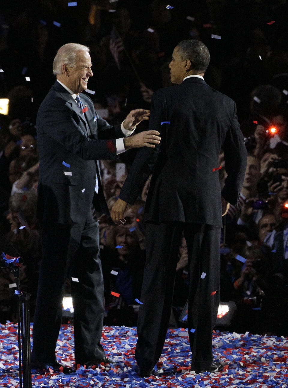 President Barack Obama talks to Vice President Joe Biden at his election night party Wednesday, Nov. 7, 2012, in Chicago. President Obama defeated Republican challenger former Massachusetts Gov. Mitt Romney. (AP Photo/Nam Y. Huh)