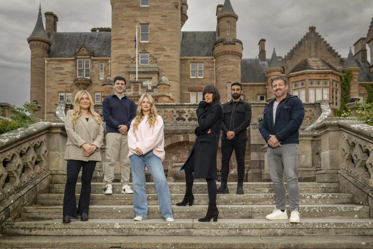 Claudia Winkleman joins The Traitors finalists Evie, Harry, Mollie, Jaz, and Andrew. (BBC)