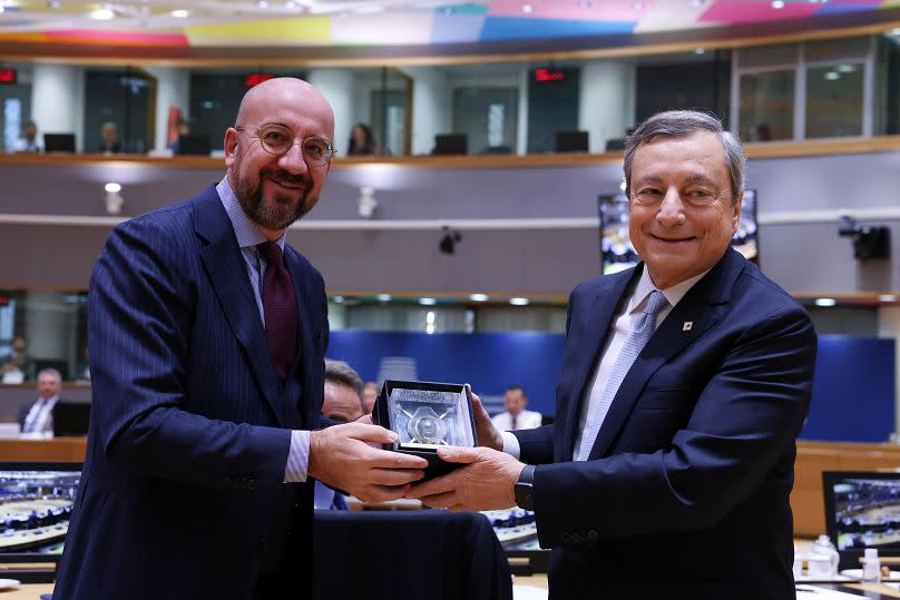 Mario Draghi receiving a scale model of the Council building (at least we guess) at his last EU leaders' gathering as Italy's PM. Is he now ready to take Michel's baton too?