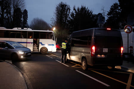 Police stand in the street outside of late French singer and actor Johnny Hallyday's home in Marnes-la-Coquette near Paris, France December 6, 2017. REUTERS/Benoit Tessier