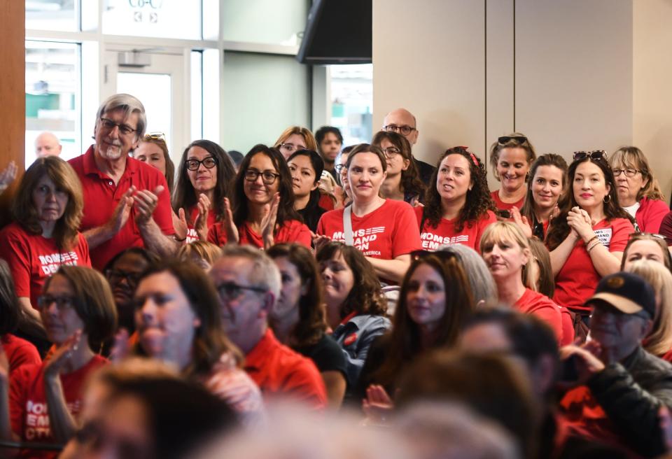 A crowd applauds Michigan Gov. Gretchen Whitmer as she addresses gun violence before signing a package of gun bills, Thursday, April 13, 2023, at Spartan Stadium in East Lansing, Mich, [Matthew Dae Smith/Lansing State Journal via AP]