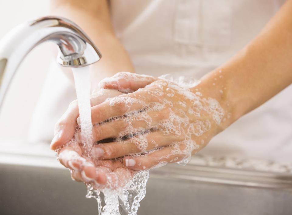 Woman washing her hands