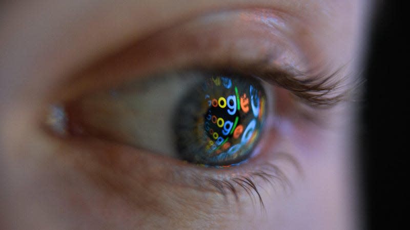 The Google logo reflected on a person's eye. 