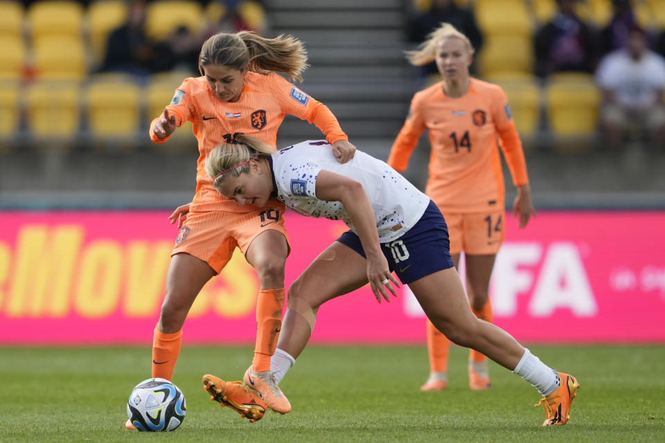 United States' Lindsey Horan and Netherlands' Danielle Van de Donk, left, battle for possession during the second half of the FIFA Women's World Cup Group E soccer match between the United States and the Netherlands in Wellington, New Zealand, Thursday, July 27, 2023. (AP Photo/John Cowpland)