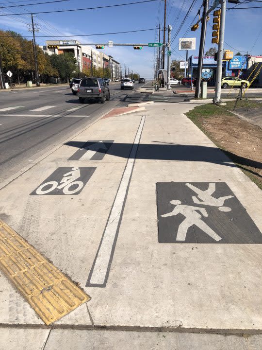 Markings on sidewalk in Austin showing shared path use. (KXAN Photo/Arezow Doost)