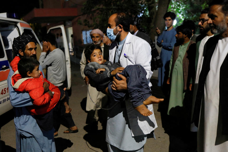 Children injured in the recent Afghan earthquake are carried to a hospital in Herat.