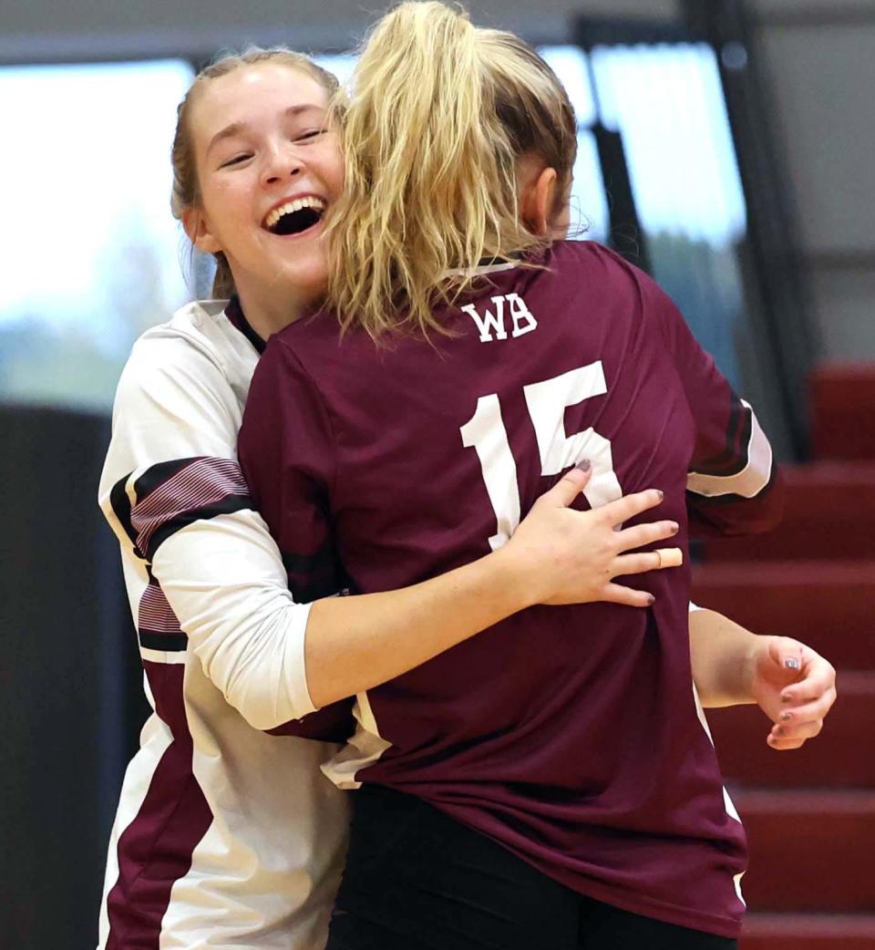 From left, West Bridgewater's Madi Ellis with teammate Julia Holland after her dig of the volleyball struck Julia during a game versus Calvary Chapel High School on Tuesday, Oct. 18, 2022.  