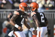 Cleveland Browns quarterback Deshaun Watson (4) is congratulated by wide receiver Amari Cooper (2) after throwing a touchdown pass to tight end David Njoku during the second half of an NFL football game against the Arizona Cardinals Sunday, Nov. 5, 2023, in Cleveland. (AP Photo/David Richard)