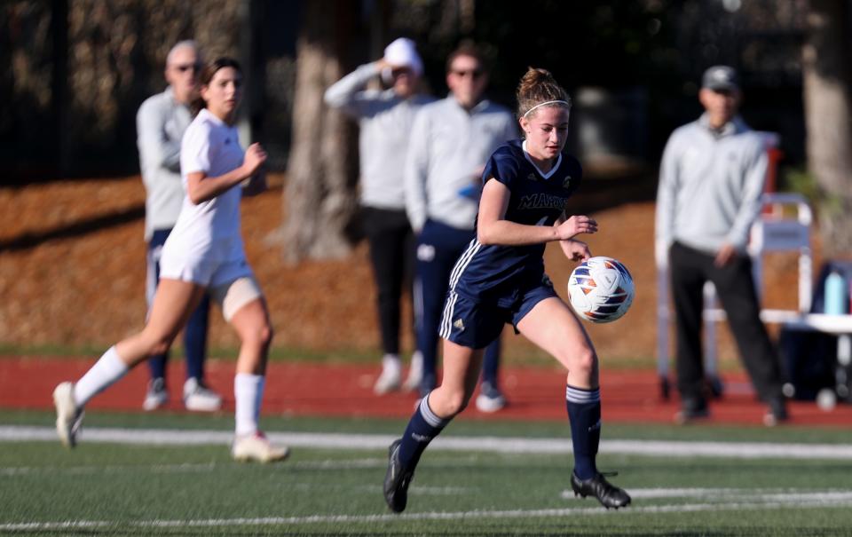 Marist Catholic's Mattie Andrus (4) moves the ball during the first half of the 4A state championship game against Hidden Valley at Liberty High School in Hillsboro, Ore. on Saturday, Nov. 12, 2022.