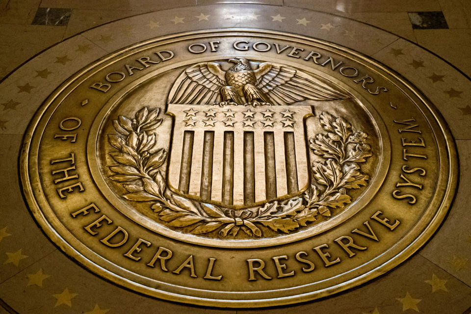 FILE - This Feb. 5, 2018, file photo shows the seal of the Board of Governors of the United States Federal Reserve System in the ground at the Marriner S. Eccles Federal Reserve Board Building in Washington. The Senate on Thursday, Dec. 3, 2020, narrowly confirmed the nomination of Christopher Waller for the Federal Reserve’s Board of Governors, placing another of President Donald Trump’s picks on the Fed’s influential board after a string of high-profile rejections. The vote in favor of Waller’s appointment was 48-47. (AP Photo/Andrew Harnik, File)