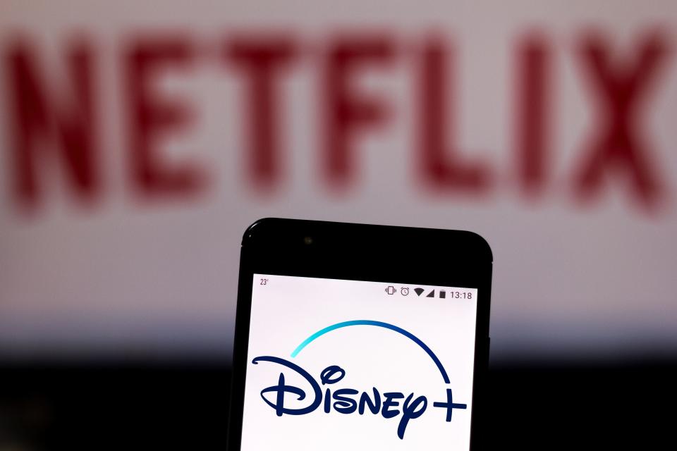 Disney+ Logo with Netflix in the background