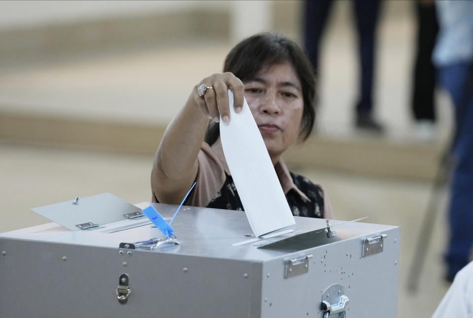 A Cambodian villager casts a ballot for voting at a polling station at Takhmua in Kandal province, southeast Phnom Penh, Cambodia, Sunday, July 23, 2023. Cambodians go to the polls Sunday with incumbent Prime Minister Hun Sen and his party all but assured a landslide victory thanks to the effective suppression and intimidation of any real opposition that critics say has made a farce of democracy in the Southeast Asian nation. (AP Photo/Heng Sinith)