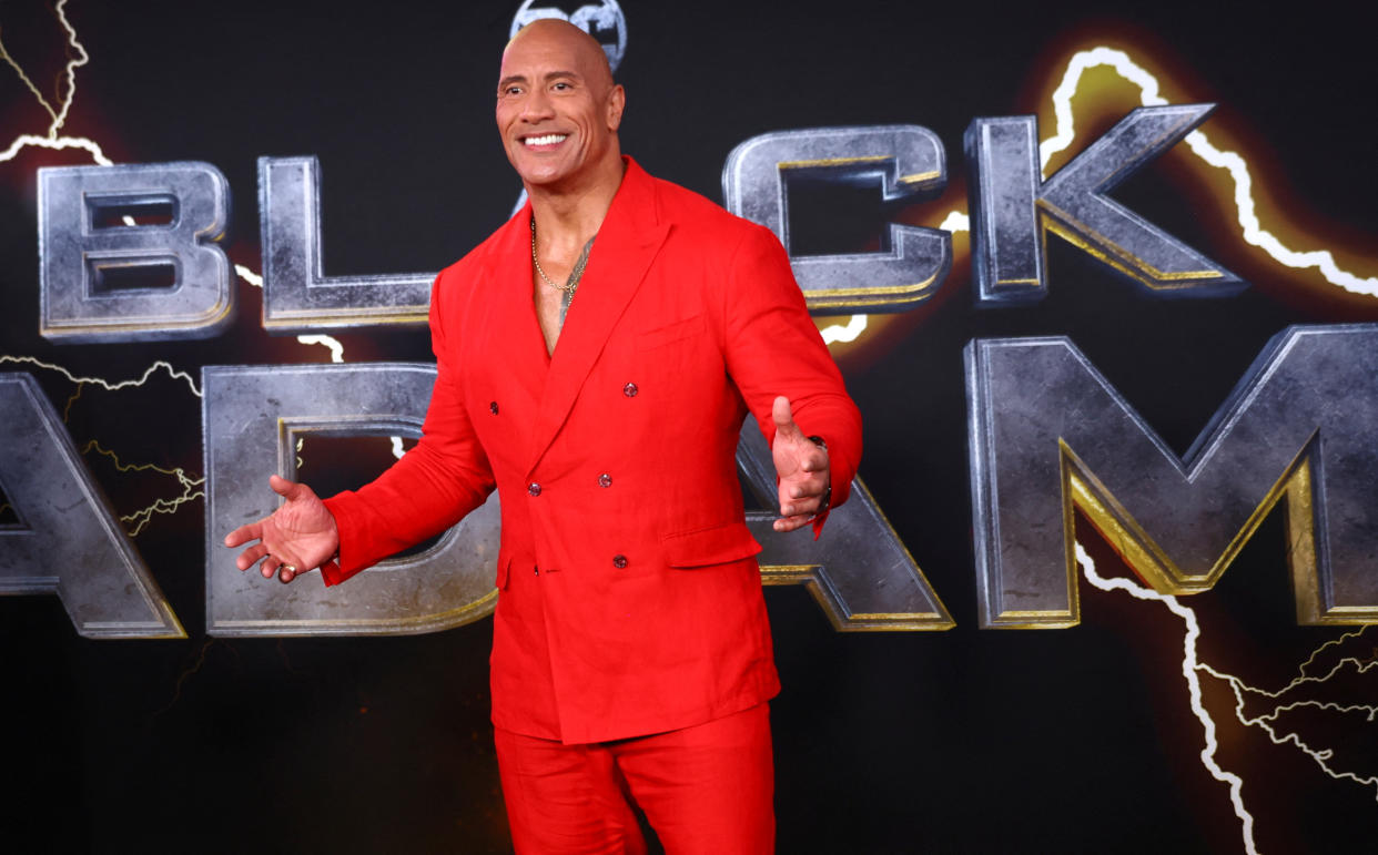 Actor Dwayne Johnson posses for photographers as he arrives for the world premiere of Warner Bros. Discovery's 'Black Adam' in Times Square in New York City, New York, U.S., October 12, 2022.  REUTERS/Mike Segar