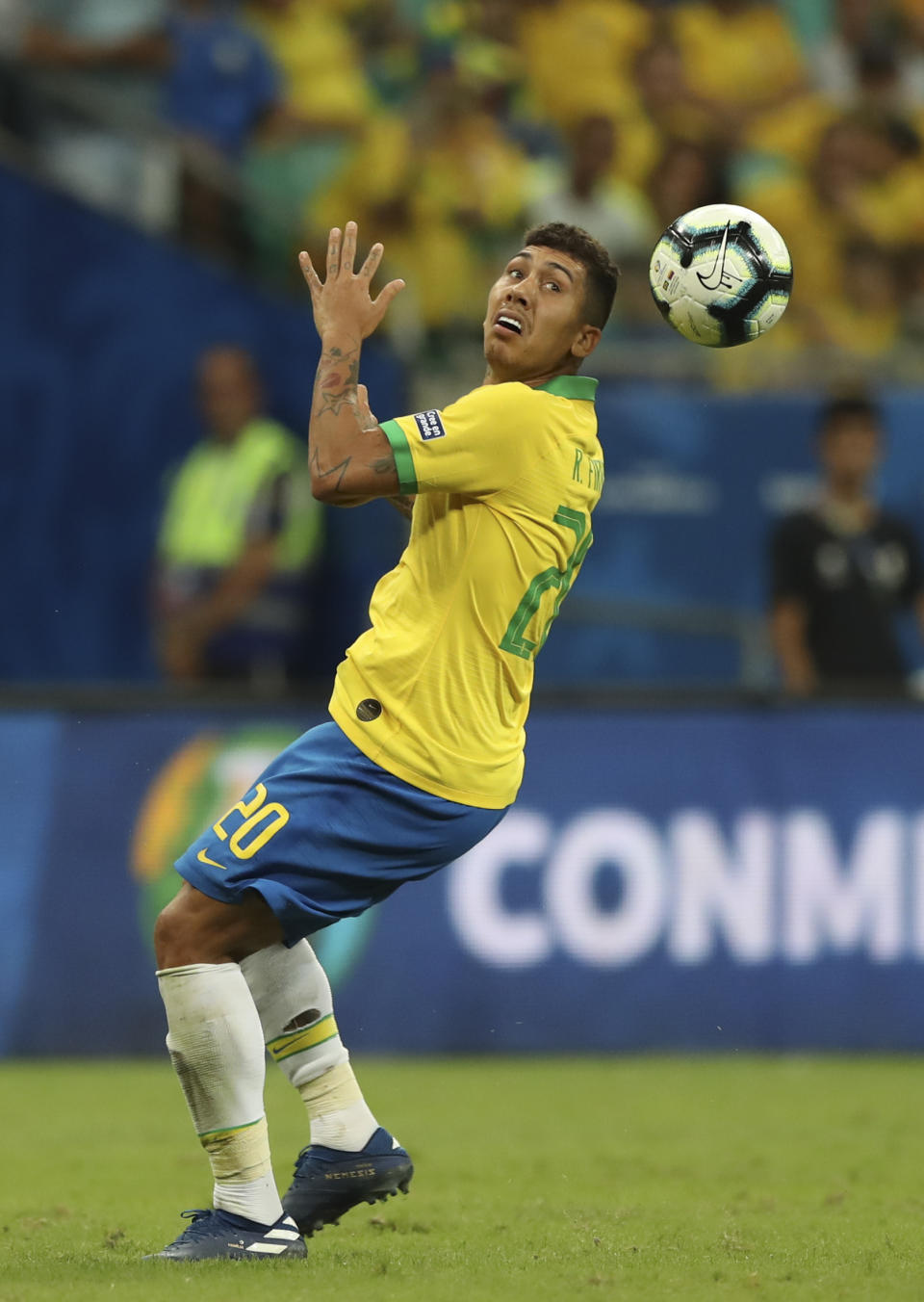 Brazil's Roberto Firmino eyes the ball during a Copa America Group A soccer match against Venezuela at the Arena Fonte Nova in Salvador, Brazil, Tuesday, June 18, 2019. (AP Photo/Ricardo Mazalan)