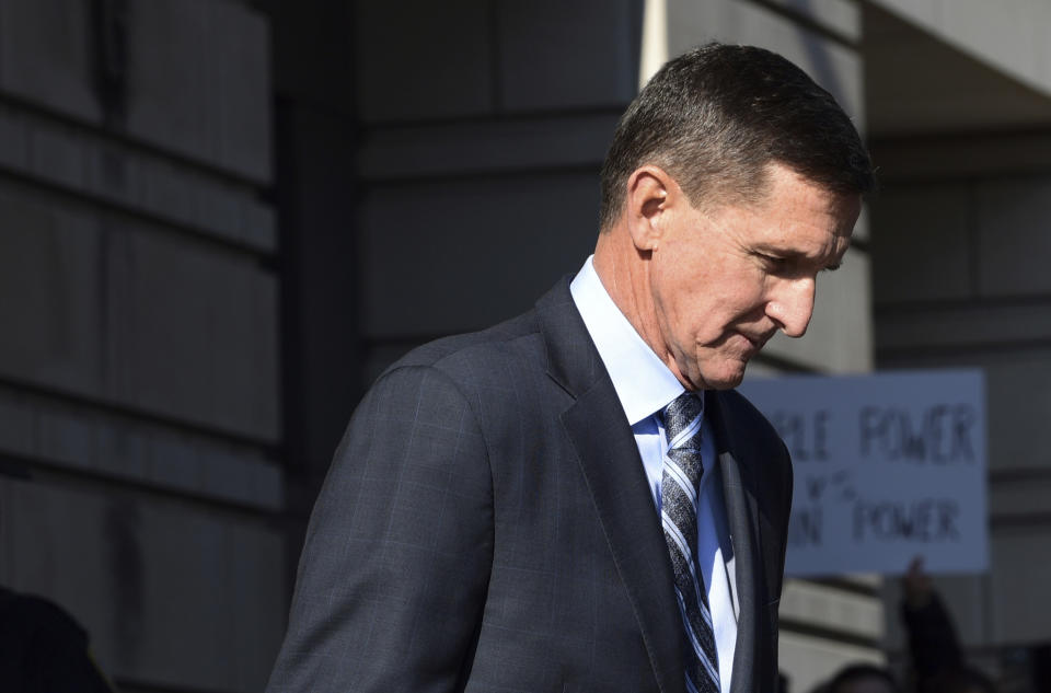 FILE - In this Dec. 1, 2017, file photo, former Trump national security adviser Michael Flynn leaves federal court in Washington. (AP Photo/Susan Walsh, File)