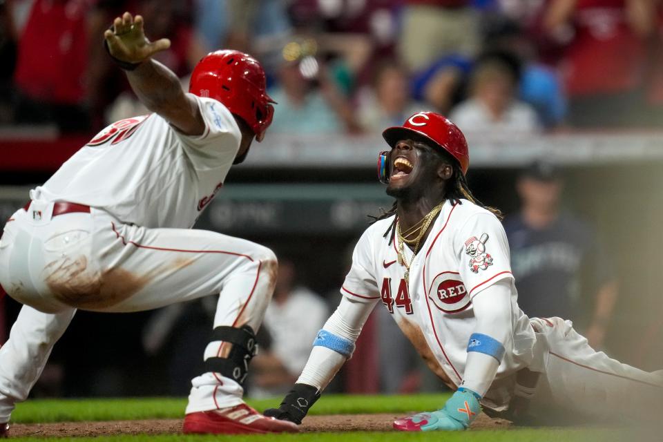 Cincinnati Reds shortstop Elly De La Cruz (44) scores from from second base for the winning run on a single off the bat of first baseman Christian Encarnacion-Strand (33) in the ninth inning of the MLB interleague between the Cincinnati Reds and the Seattle Mariners at Great American Ball Park in downtown Cincinnati on Tuesday, Sept. 5, 2023. The Reds won 7-6 on a walk-off single by Christian Encarnacion-Strand, scoring Elly De La Cruz from second base.