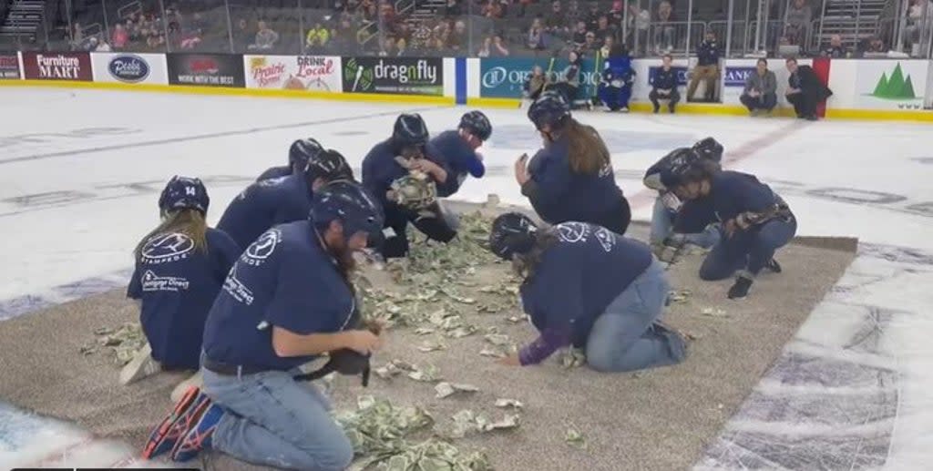 Teachers in South Dakota at the bizarre ‘Dash for Cash’ event (Twitter/ Annie Todd)