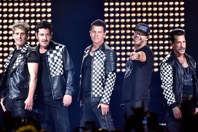 <p>Tim Mosenfelder/Getty</p> Joey McIntyre, Jonathan Knight, Jordan Knight, Donnie Wahlberg, and Danny Wood of New Kids on the Block performing on the Mixtape Tour in 2022