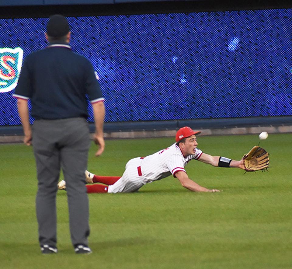Senior centerfielder Max Mickel goes all out for this flyball during the District 2 Class 4A championship game against Dallas.