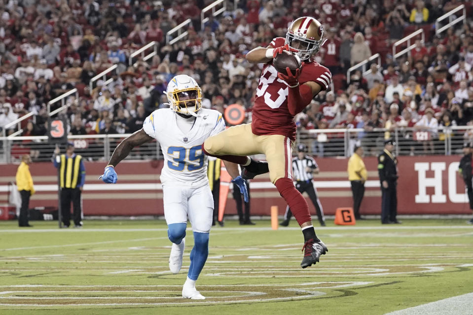 San Francisco 49ers wide receiver Willie Snead IV (83) catches a touchdown in front of Los Angeles Chargers cornerback Michael Jacquet (39) during the second half of a preseason NFL football game Friday, Aug. 25, 2023, in Santa Clara, Calif. (AP Photo/Godofredo A. Vásquez)