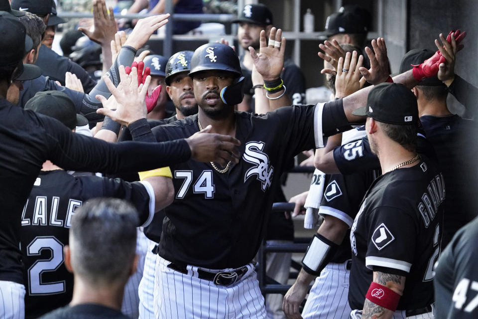Chicago White Sox's Eloy Jimenez (74) celebrates with teammates after hitting a three-run home run during the first inning of a baseball game against the Minnesota Twins in Chicago, Saturday, Sept. 3, 2022. (AP Photo/Nam Y. Huh)
