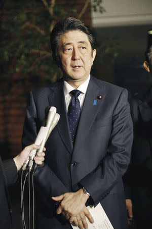 Japanese Prime Minister Shinzo Abe speaks to reporters after South Korea and Japan reached an agreement on "comfort women" issue at the prime minister's office in Tokyo, Japan, December 28, 2015. Mandatory credit REUTERS/Kyodo