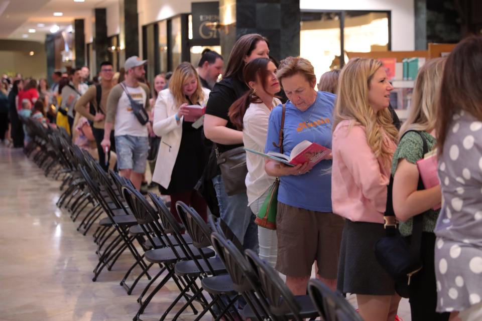 People wait in line Monday outside of Full Circle Bookstore in Oklahoma City during a book signing event for Kristin Chenoweth's new book.