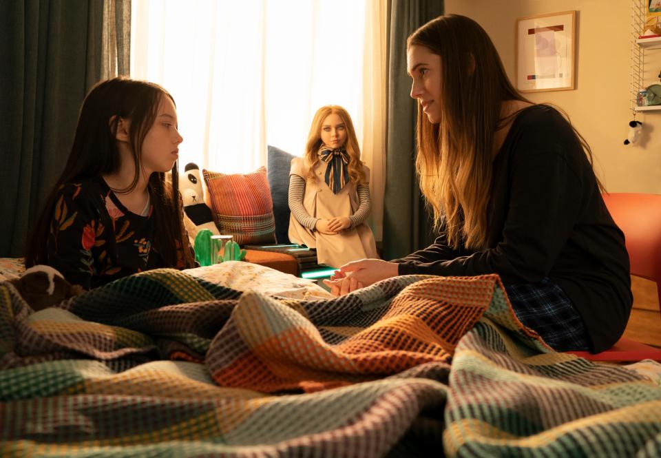 After a tragedy, Cady (Violet McGraw, left) moves in with her aunt Gemma (Allison Williams) and gets a high-tech new pal in the satirical horror film "M3GAN."