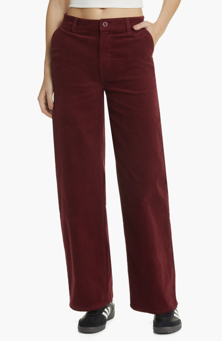 a model wearing the burgundy wide leg pants